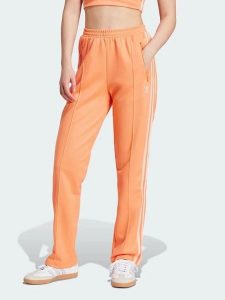 Adidas Spodnie dresowe w kolorze pomarańczowym rozmiar: XS. Pomarańczowe spodnie dresowe ADIDAS, xs, bez wzorów, z dresówki. Za 123,25 zł.