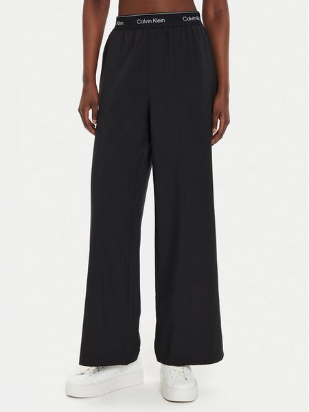 Calvin Klein Performance Spodnie dresowe 00GWF4P606 Czarny Wide Leg. Czarne spodnie dresowe Calvin Klein Performance, s, bez wzorów, z dresówki. Za 369,99 zł.