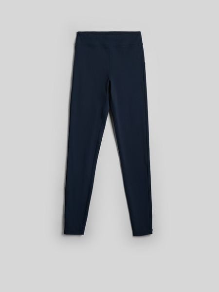 4F Legginsy dzianinowe damskie - granatowe M. Niebieskie legginsy 4f, bez wzorów, z dzianiny, z podwyższonym stanem. Za 129,99 zł.