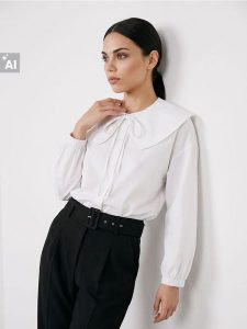 Bawełniana koszula z szerokim kołnierzem - biały. Białe koszule Sinsay, l, bez wzorów, z bawełny, bez kołnierzyka, bez ramiączek. Za 59,99 zł.