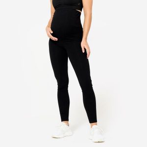 Legginsy do jogi damskie Kimjaly ciążowe. Czarne legginsy DOMYOS, bez wzorów, z bawełny. Za 69,99 zł.