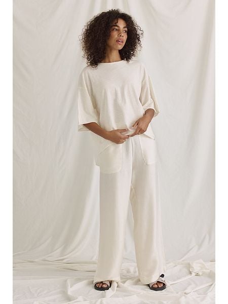 Cotton Candy Koszulka "Noelani" w kolorze kremowym rozmiar: M. Brązowe bluzki Cotton Candy, m, bez wzorów, z bawełny, z asymetrycznym kołnierzem, bez ramiączek. Za 104,64 zł.