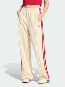 Adidas Spodnie dresowe 159027 Żółty Loose Fit. Żółte spodnie dresowe ADIDAS, xl, bez wzorów, z dresówki. Za 298,99 zł.