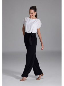 SWING Kombinezon w kolorze czarno-białym rozmiar: 44. Czarne kombinezony Swing, bez wzorów, z tkaniny, bez kołnierzyka, bez ramiączek. Za 289,20 zł.