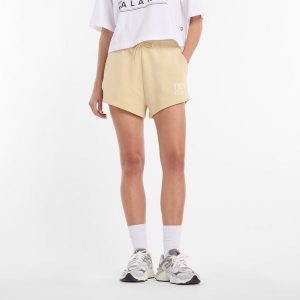 Spodenki damskie New Balance WB61Y80AABC – żółte. Żółte szorty New Balance, bez wzorów, z bawełny, klasyczne. Za 199,99 zł.