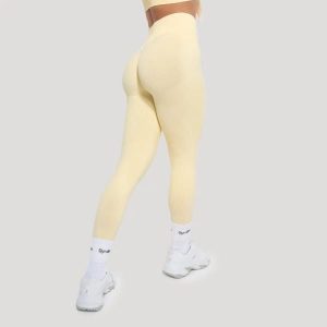 Legginsy damskie fitness bezszwowe Luma. Żółte legginsy GYMBEAM, bez wzorów, z elastanu, z podwyższonym stanem. Za 110,90 zł.