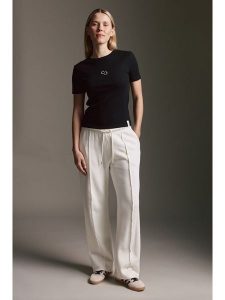 Cotton Candy Spodnie dresowe w kolorze kremowym rozmiar: XS. Brązowe spodnie dresowe Cotton Candy, xs, bez wzorów, z dresówki. Za 113,10 zł.