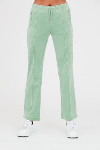 JUICY COUTURE Seledynowe spodnie dresowe Tina. Niebieskie spodnie dresowe Juicy Couture, s, bez wzorów, z dresówki. W wyprzedaży za 229,99 zł.