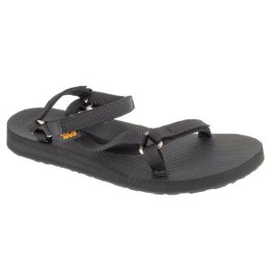 Sandały Teva Original Universal Slim Sandals 1150110-BLK czarne. Czarne sandały bez wzorów, z materiału, bez obcasa, bez zapięcia. W wyprzedaży za 380,38 zł.