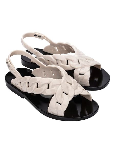 Melissa Sandały w kolorze białym rozmiar: 38. Białe sandały Melissa, bez wzorów, z otwartym noskiem, bez obcasa, bez zapięcia. Za 173,95 zł.
