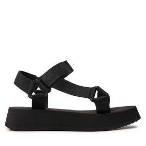 Sandały Calvin Klein Jeans. Czarne sandały Calvin Klein Jeans, bez wzorów, z jeansu, bez obcasa, na płaskiej podeszwie, bez zapięcia. Za 319,99 zł.