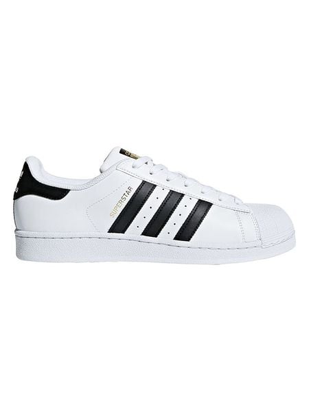 Adidas Skórzane sneakersy "Superstar" w kolorze biało-czarnym rozmiar: 47 1/3. Białe trampki ADIDAS, bez wzorów, bez zapięcia. Za 253,54 zł.