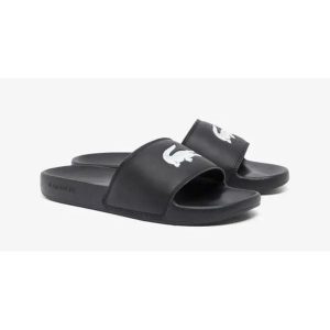 Klapki Sportowe Damskie Lacoste Serve Slide. Czarne klapki Lacoste, bez wzorów, z materiału, bez obcasa. Za 155,20 zł.