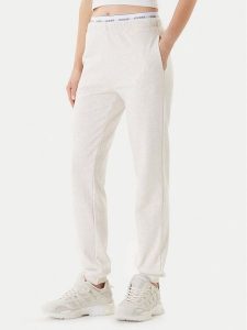 Guess Spodnie dresowe O5RB01 KCO31 Beżowy Regular Fit. Brązowe spodnie dresowe Guess, xl, z aplikacjami, z bawełny. Za 209,99 zł.