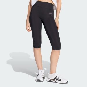 Legginsy Optime Essentials Capri. Czarne legginsy ADIDAS, bez wzorów, z elastanu. Za 199,00 zł.