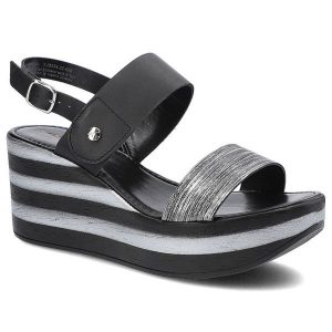 Czarne Sandały Tamaris Damskie Buty Na Koturnie. Czarne sandały Tamaris, bez wzorów, ze skóry ekologicznej, bez obcasa, na koturnie, bez zapięcia. Za 199,00 zł.