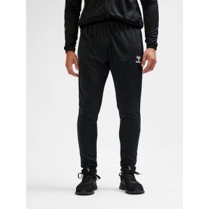 SPODNIE hmlESSENTIAL TRAINING PANTS. Czarne spodnie dresowe Hummel, m, bez wzorów, z dresówki, do piłki nożnej. Za 100,00 zł.