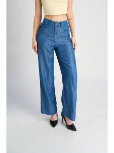 Marks & Spencer Spodnie w kolorze niebieskim rozmiar: 44. Niebieskie spodnie z wysokim stanem Marks & Spencer, bez wzorów, z lyocellu, z podwyższonym stanem. Za 52,42 zł.