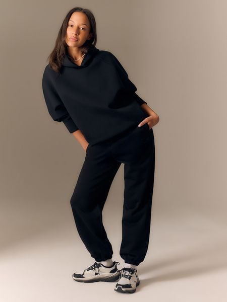 4F Bluza dresowa loose z kapturem damska - czarna L. Czarne bluzy 4f, l, bez wzorów, z dresówki, z kapturem. Za 249,99 zł.