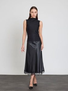 BGN Top w kolorze czarnym rozmiar: 40. Czarne topy BGN, bez wzorów, bez kołnierzyka, bez ramiączek. Za 78,99 zł.