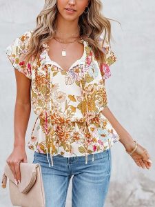 Milan Kiss Bluzka w kolorze kremowym ze wzorem rozmiar: M. Brązowe bluzki Milan Kiss, m, bez wzorów, bez kołnierzyka, bez ramiączek. Za 105,63 zł.