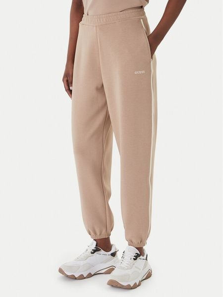 Guess Spodnie dresowe V6GB02 K2915 Beżowy Regular Fit. Brązowe spodnie dresowe Guess, l, z aplikacjami, z dresówki. Za 394,99 zł.