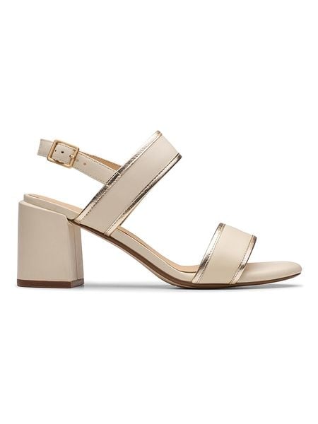 Clarks Skórzane sandały "Ezoria Sling" w kolorze złoto-beżowym na obcasie rozmiar: 37,5. Brązowe sandały Clarks, bez wzorów, z otwartym noskiem, bez obcasa, na koturnie, bez zapięcia. Za 188,40 zł.
