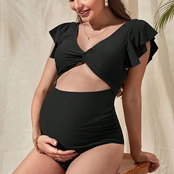 Strój kąpielowy ciążowy z falbanką na plażę i basen Britani. Czarne stroje jednoczęściowe Intica, bez wzorów. Za 149,00 zł.