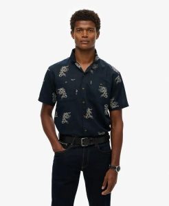Superdry Krótki rękaw plażowa koszula z lnu – Draconic Navy. Niebieskie koszule Superdry, l, z aplikacjami, z bawełny, bez kołnierzyka, bez ramiączek. Za 266,10 zł.