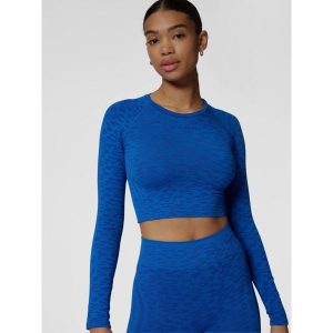 Damski crop top z długim rękawem Hummel MT Leo. Niebieskie topy Hummel, bez wzorów, sportowe, bez kołnierzyka, bez ramiączek. Za 182,50 zł.