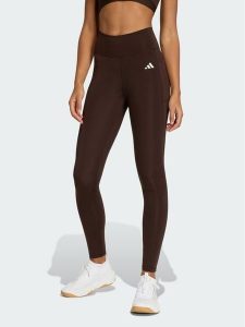 Adidas Legginsy Optimé Essentials Stash JZ0824 Brązowy Slim Fit. Brązowe legginsy sportowe ADIDAS, xs, bez wzorów, z syntetyku, na fitness i siłownię. Za 199,99 zł.