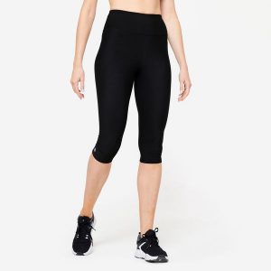 Legginsy fitness damskie Domyos krótkie. Czarne legginsy DOMYOS, bez wzorów, z elastanu, z podwyższonym stanem, krótkie. Za 49,99 zł.