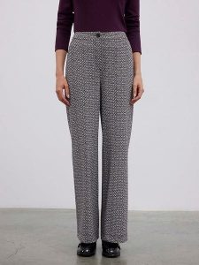 BGN Spodnie w kolorze czarno-białym rozmiar: 40. Czarne spodnie z wysokim stanem BGN, bez wzorów, z materiału, z podwyższonym stanem. Za 117,45 zł.