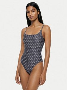 Guess Strój kąpielowy E6GJ47 KCBJ0 Granatowy. Niebieskie stroje jednoczęściowe Guess, z aplikacjami, z syntetyku. Za 387,99 zł.