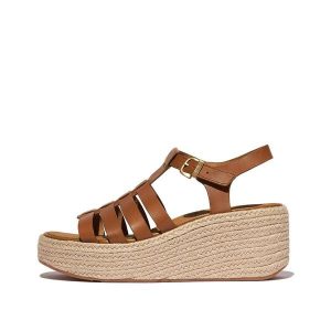 Klapki na koturnie w stylu rybaka damskie FitFlop Platfforms. Brązowe klapki FIT FLOP, bez wzorów, z materiału, bez obcasa, na koturnie. Za 433,35 zł.