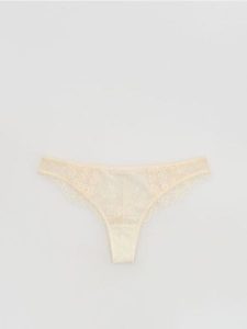 Koronkowe majtki stringi - złamana biel. Stringi Reserved, bez wzorów, z koronki. Za 39,99 zł.