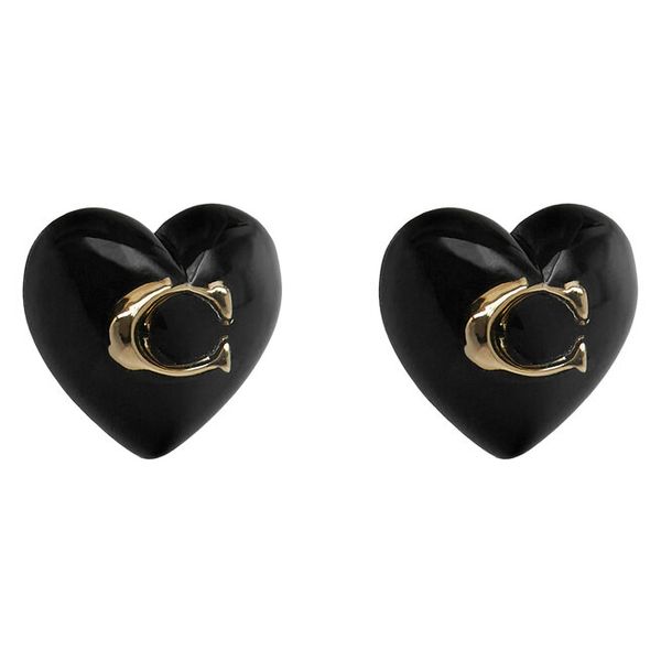 Kolczyki Coach. Żółte kolczyki Coach, złote. Za 169,99 zł.