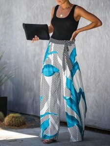 Milan Kiss Spodnie w kolorze szaro-niebiesko-białym rozmiar: XL. Niebieskie spodnie z wysokim stanem Milan Kiss, bez wzorów, z materiału, z podwyższonym stanem. Za 152,99 zł.