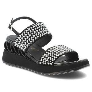 Sandały damskie S.Barski, cholewka ze skóry naturalnej na masywnej podeszwie z ozdobnymi nitami na szerokich paskach łączą rockowy charakter z komfor. Czarne sandały S.BARSKI, z aplikacjami, ze skóry, bez obcasa, na koturnie, bez zapięcia. Za 278,90 zł.