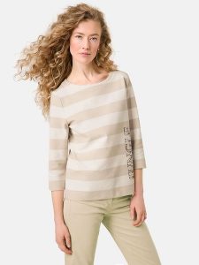 Gerry Weber Koszulka w kolorze beżowo-kremowym rozmiar: 42. Brązowe bluzki Gerry Weber, bez wzorów, bez kołnierzyka, bez ramiączek. Za 136,13 zł.