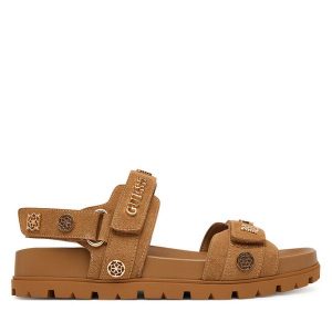 Sandały Guess. Brązowe sandały Guess, z aplikacjami, bez obcasa, na płaskiej podeszwie, bez zapięcia. Za 549,99 zł.