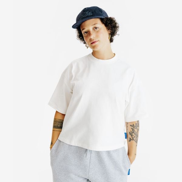 Koszulka Crop damska. Białe bluzki DECATHLON, xl, bez wzorów, z bawełny, bez kołnierzyka, bez ramiączek. Za 54,99 zł.