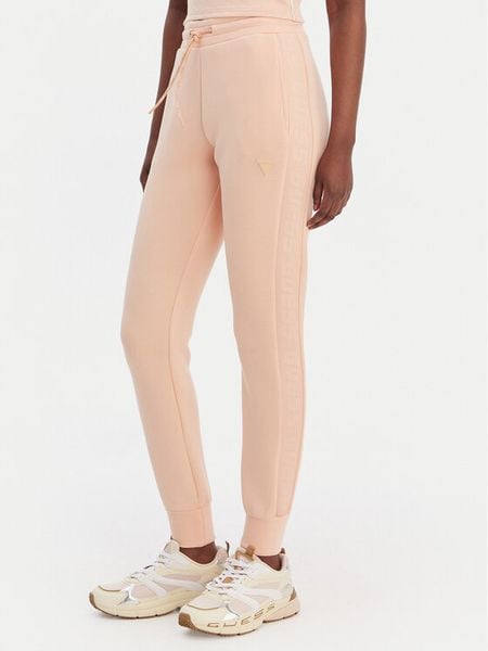 Guess Spodnie dresowe V2YB18 K7UW2 Pomarańczowy Regular Fit. Brązowe spodnie dresowe Guess, l, z aplikacjami, z dresówki. Za 364,99 zł.