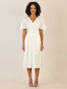 APART Sukienka w kolorze kremowym rozmiar: 36. Brązowe sukienki Apart, bez wzorów, z tkaniny, bez kołnierzyka, bez ramiączek, midi. Za 187,99 zł.