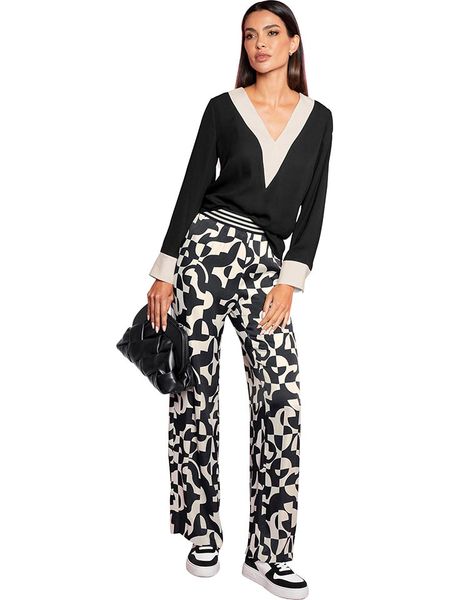 Heine Bluzka w kolorze czarnym rozmiar: 40. Czarne bluzki Heine, bez wzorów, bez kołnierzyka, bez ramiączek. Za 61,31 zł.