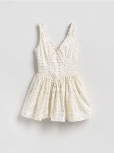 Kombinezon z bawełną - złamana biel. Kombinezony Reserved, bez wzorów, z bawełny, bez kołnierzyka, bez ramiączek. Za 159,99 zł.