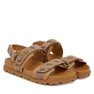 Sandały Guess. Brązowe sandały Guess, z aplikacjami, bez obcasa, na płaskiej podeszwie, bez zapięcia. Za 499,99 zł.