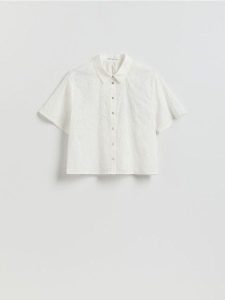 Ażurowa koszula - biały. Białe koszule Reserved, l, w ażurowe wzory, z bawełny, bez kołnierzyka, bez ramiączek. Za 109,99 zł.