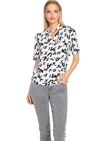 Heine Koszulka w kolorze biało-czarnym rozmiar: 40. Białe bluzki Heine, bez wzorów, bez kołnierzyka, bez ramiączek. Za 30,56 zł.