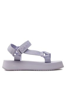 Calvin Klein Jeans Sandały Sandal Velcro Webbing In Mtl YW0YW01480 Fioletowy. Fioletowe sandały Calvin Klein Jeans, bez wzorów, z jeansu, bez obcasa, na płaskiej podeszwie, bez zapięcia. Za 299,99 zł.